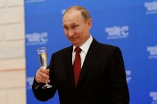 Vladimir Putin holding a glass.jpg